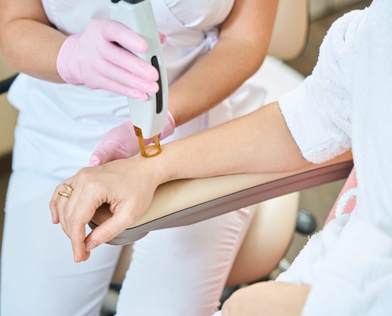 partial-image-of-female-beautician-doing-laser-epi-2024-02-06-14-52-45-utc-scaled.jpg